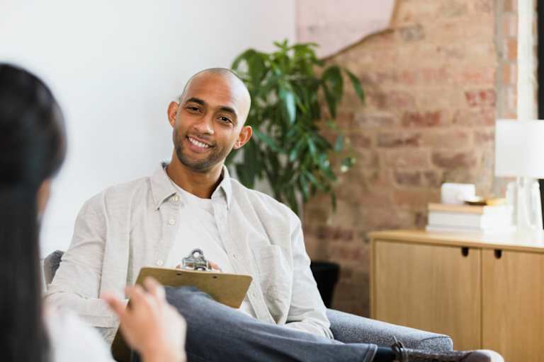 Counselor speaking to adult