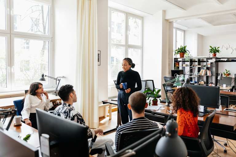 Informal office meeting with colleagues