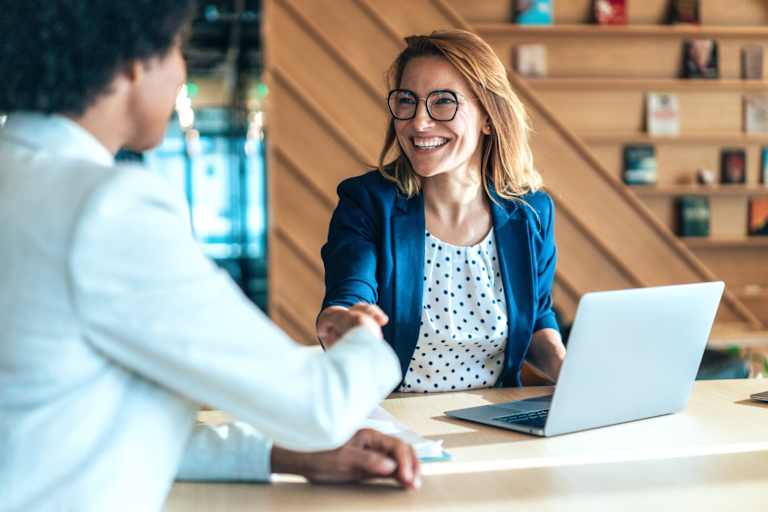 Social psychologist shaking hands with colleague