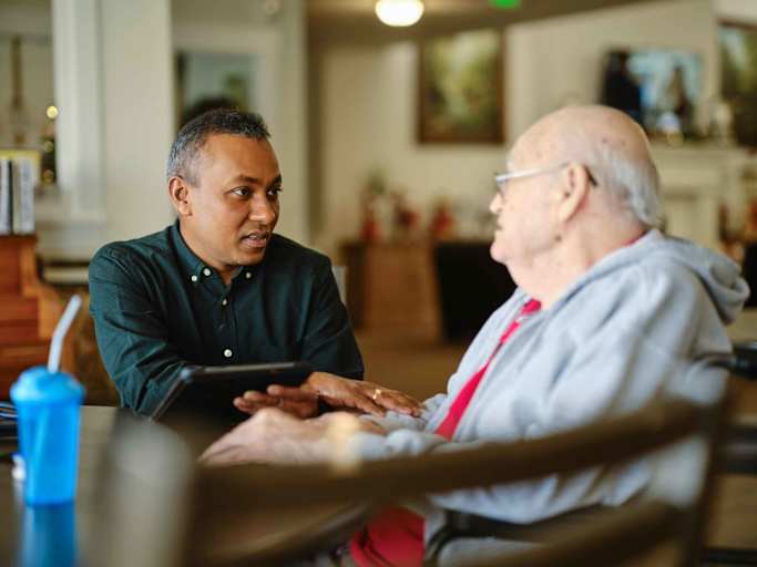 Social worker helping senior client